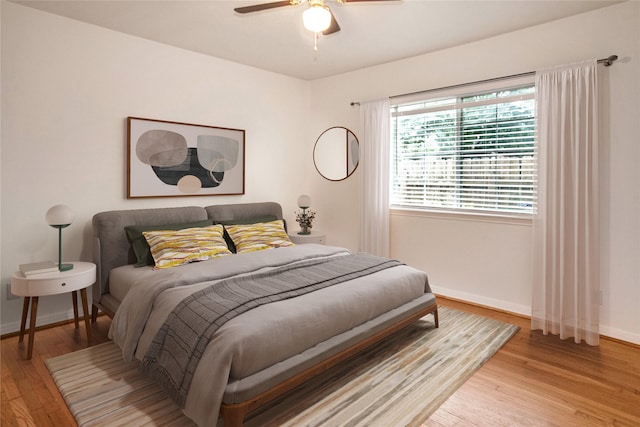 bedroom featuring ceiling fan and hardwood / wood-style flooring