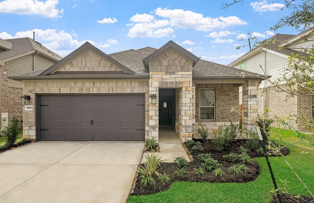 view of front of house with a front yard and a garage