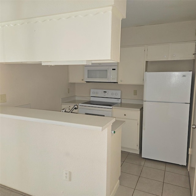 kitchen featuring white cabinets, light tile patterned flooring, white appliances, and kitchen peninsula