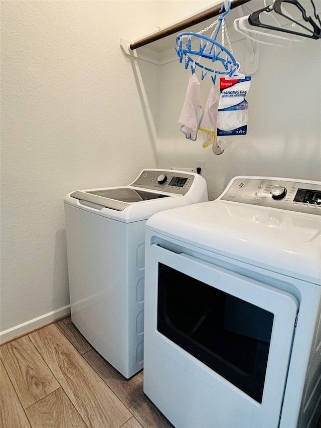 washroom with washing machine and clothes dryer