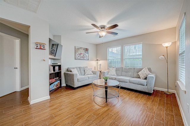 living room featuring ceiling fan