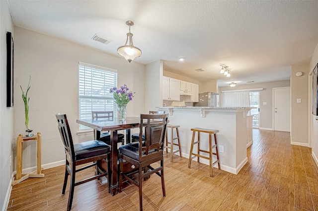 dining area featuring light hardwood / wood-style floors