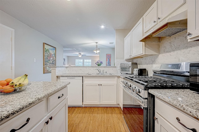 kitchen with gas range, ceiling fan, sink, dishwasher, and white cabinetry