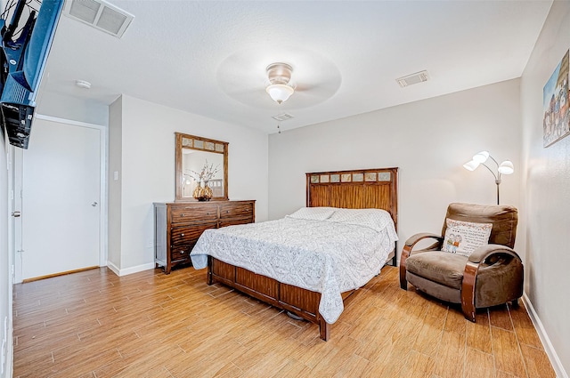 bedroom featuring ceiling fan and light wood-type flooring