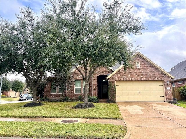 view of front of house with a garage and a front lawn