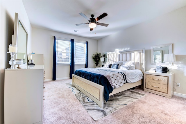 bedroom featuring ceiling fan and light colored carpet