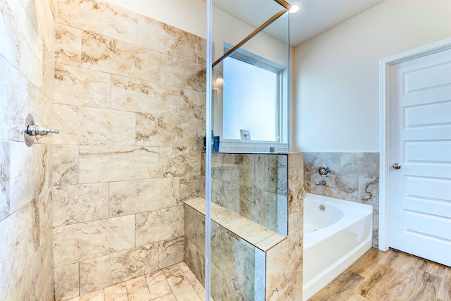 bathroom with shower with separate bathtub