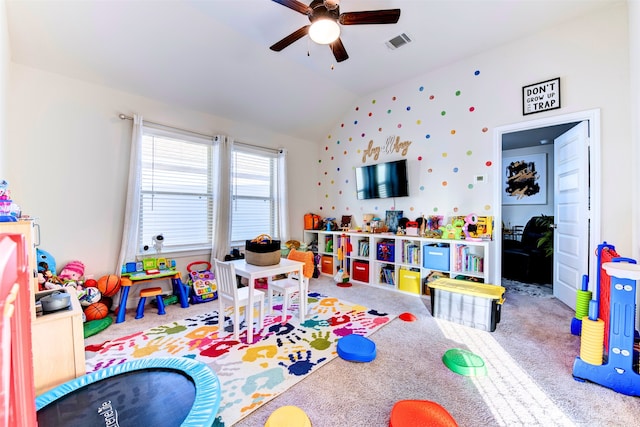 game room with carpet flooring, ceiling fan, and vaulted ceiling