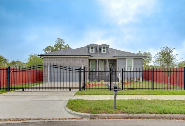 view of front of house with a front yard and a garage