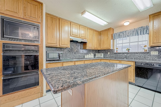 kitchen with exhaust hood, a kitchen island, black appliances, and light tile patterned floors