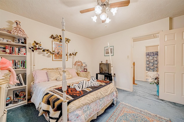 carpeted bedroom with ceiling fan and a textured ceiling