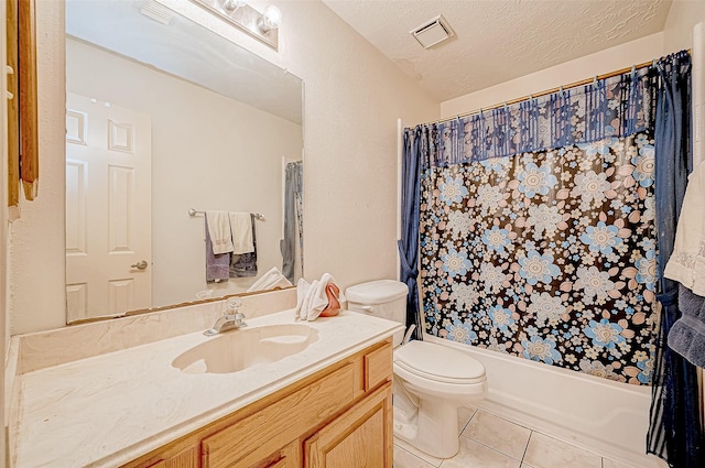 full bathroom with vanity, tile patterned floors, shower / bath combination with curtain, toilet, and a textured ceiling