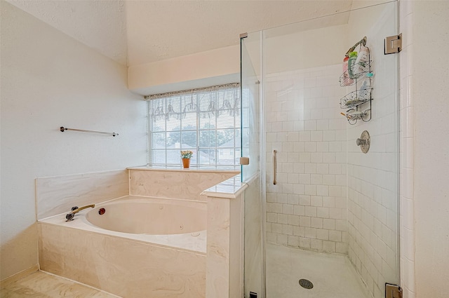 bathroom with tile patterned flooring and independent shower and bath