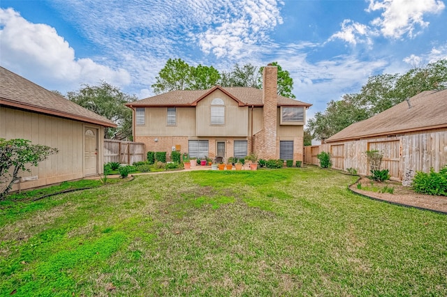 back of property featuring a patio area and a yard