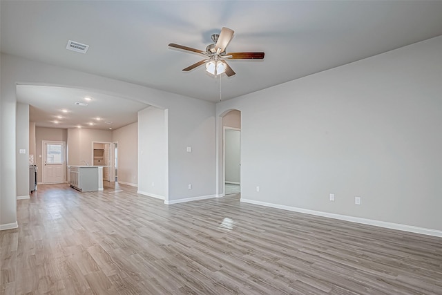 unfurnished living room with ceiling fan and light wood-type flooring