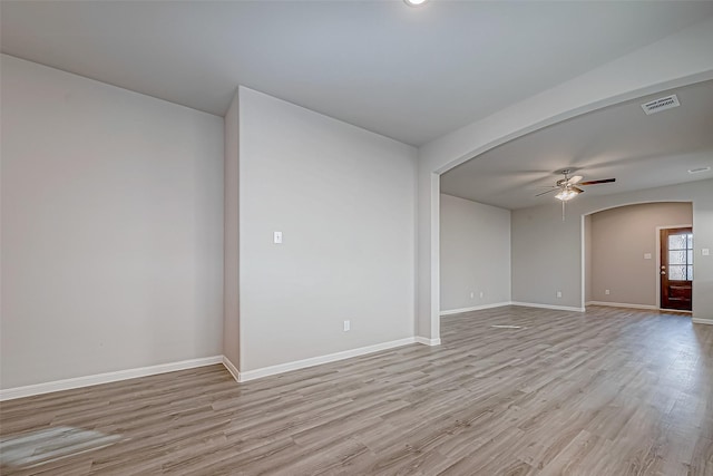 unfurnished room with ceiling fan and light wood-type flooring