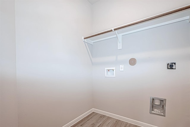 laundry area featuring hookup for an electric dryer, hookup for a washing machine, and light hardwood / wood-style flooring