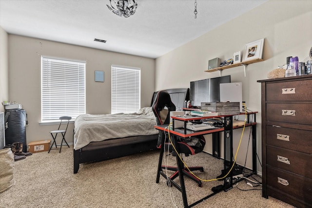 bedroom with light carpet