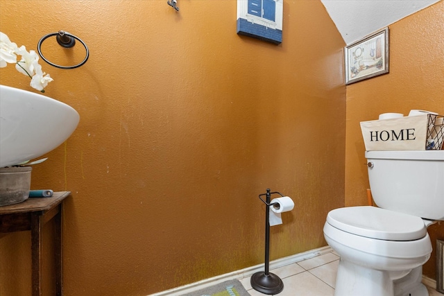 bathroom with tile patterned floors and toilet