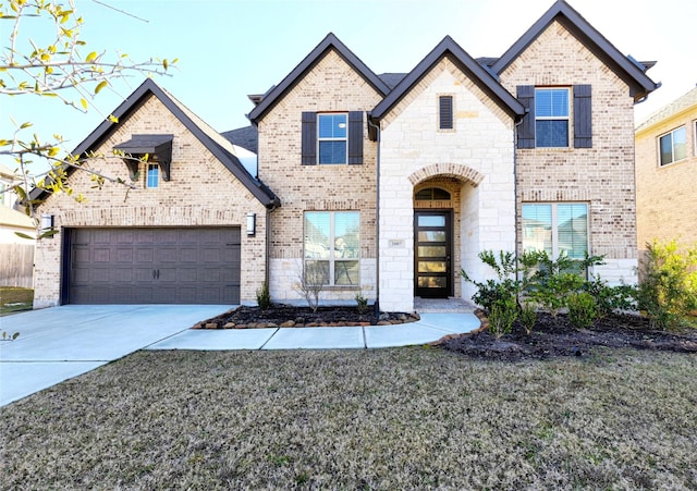 view of front of home featuring a garage and a front yard