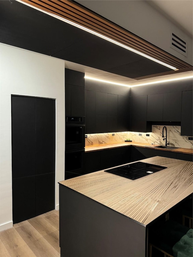 kitchen featuring sink and black appliances