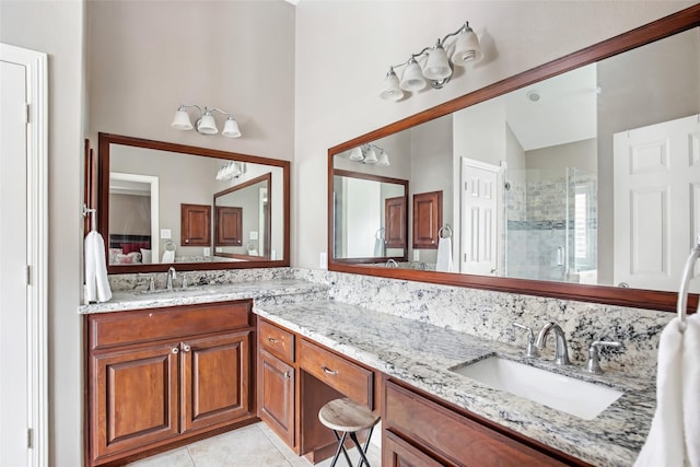 bathroom featuring tile patterned floors, vanity, an enclosed shower, and vaulted ceiling