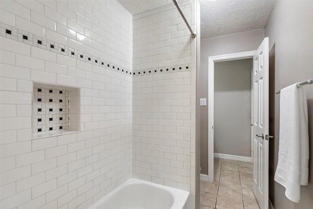 bathroom featuring tile patterned flooring, a textured ceiling, and shower / washtub combination