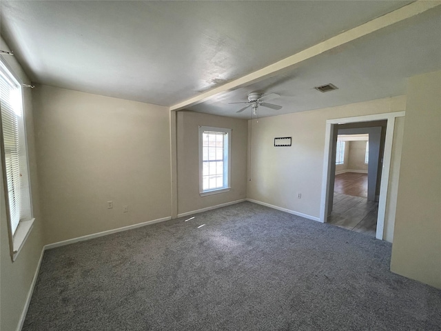 carpeted spare room featuring ceiling fan