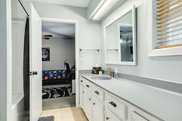 bathroom featuring tile patterned floors, vanity, and ceiling fan