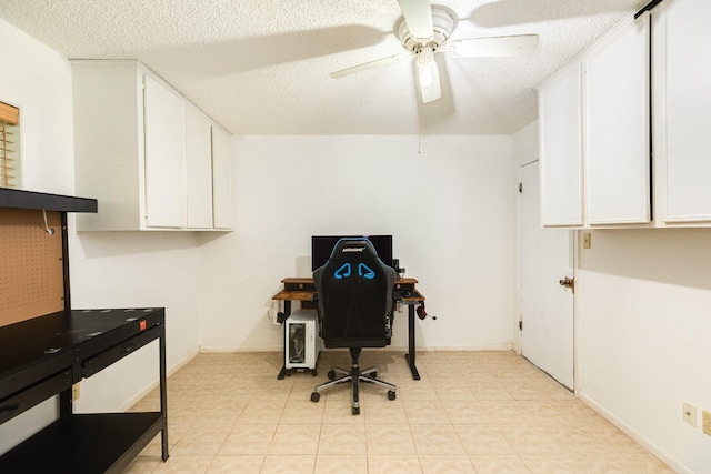 office space featuring a textured ceiling and ceiling fan