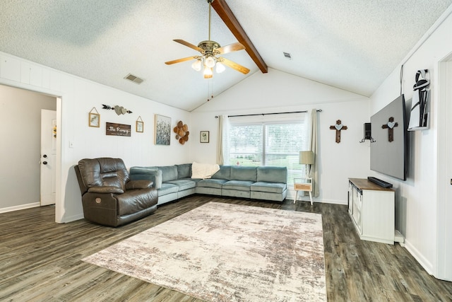 living room with vaulted ceiling with beams, a textured ceiling, dark hardwood / wood-style floors, and ceiling fan