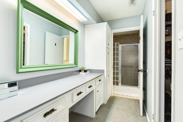 bathroom featuring vanity and walk in shower