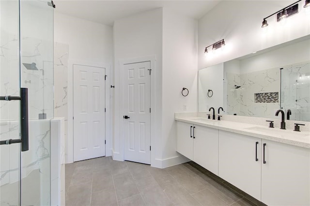 bathroom featuring vanity, tile patterned flooring, and a shower with shower door