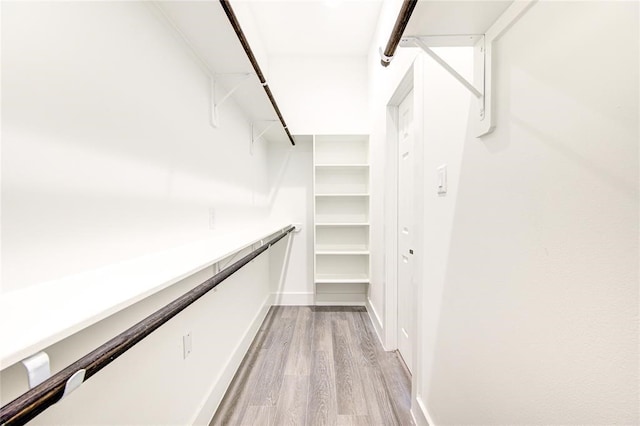 walk in closet featuring light hardwood / wood-style floors