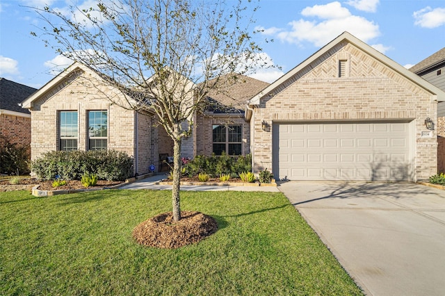 view of front facade with a garage and a front lawn