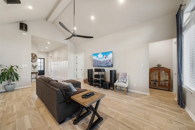 living room featuring beam ceiling, ceiling fan, and high vaulted ceiling