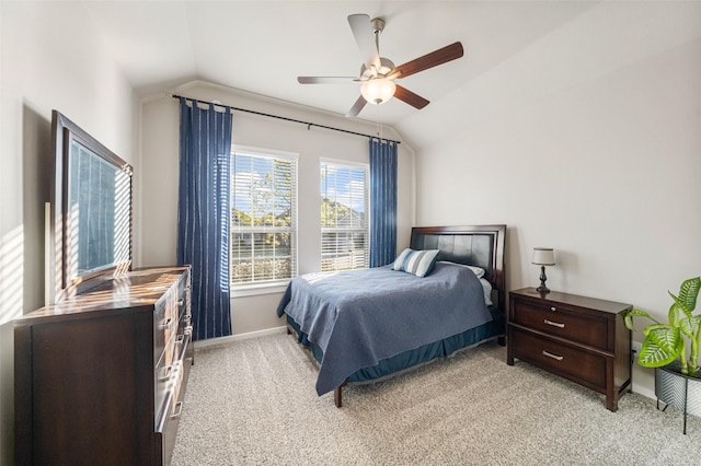 bedroom featuring ceiling fan, light colored carpet, and lofted ceiling