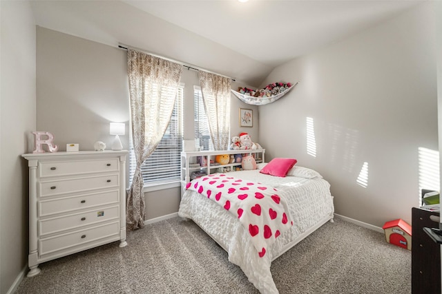 bedroom featuring carpet flooring, multiple windows, and lofted ceiling