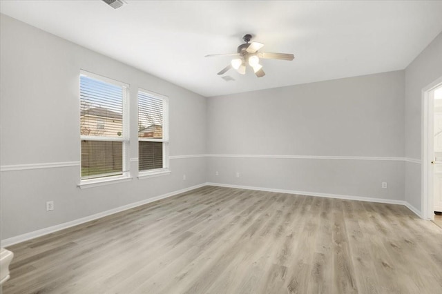 empty room featuring light wood-type flooring and ceiling fan