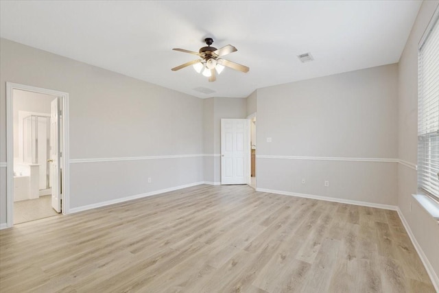 spare room featuring ceiling fan and light hardwood / wood-style flooring