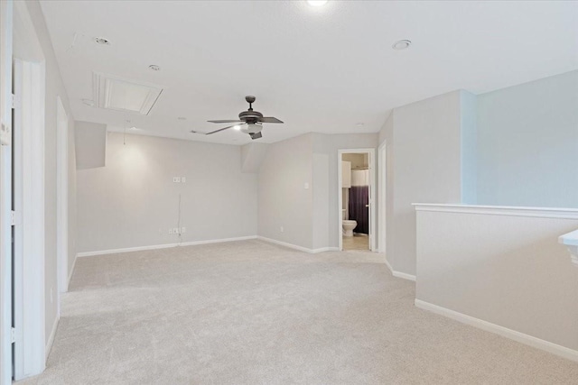 unfurnished room featuring light colored carpet and ceiling fan