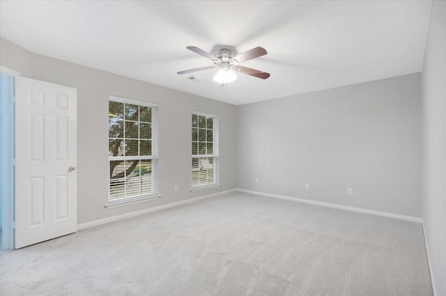 carpeted empty room with ceiling fan