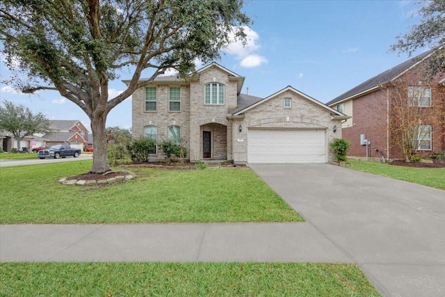 view of front of house with a front yard and a garage