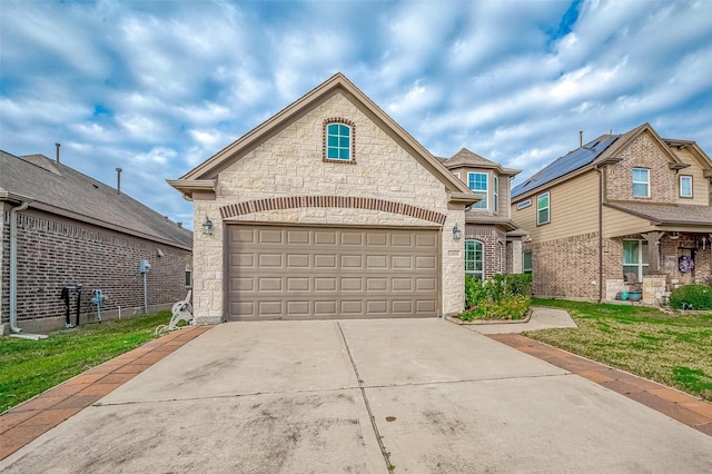 view of front of home with a front yard and a garage