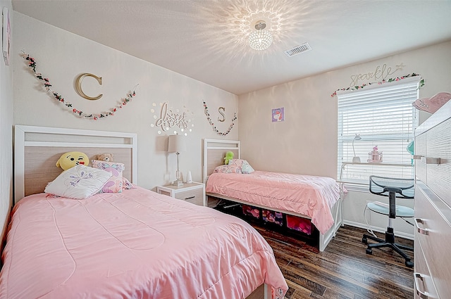 bedroom with dark wood-type flooring