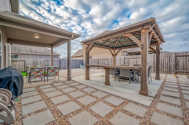 view of patio / terrace featuring a gazebo and a grill