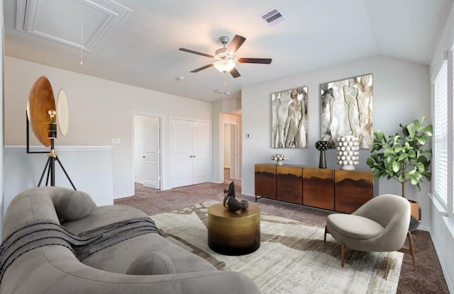 carpeted living room featuring ceiling fan and lofted ceiling