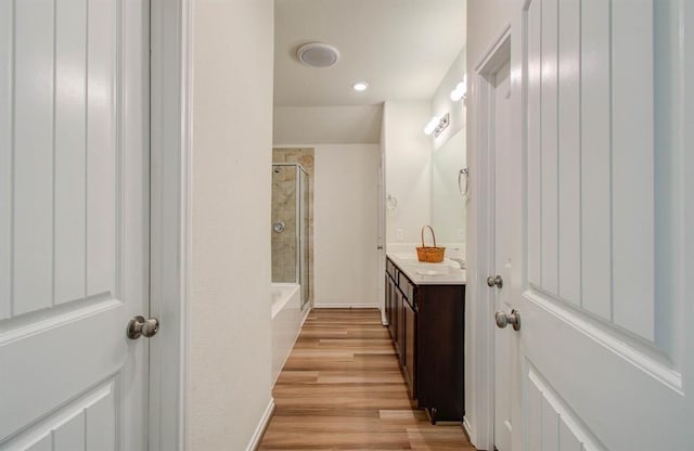 bathroom featuring vanity and wood-type flooring