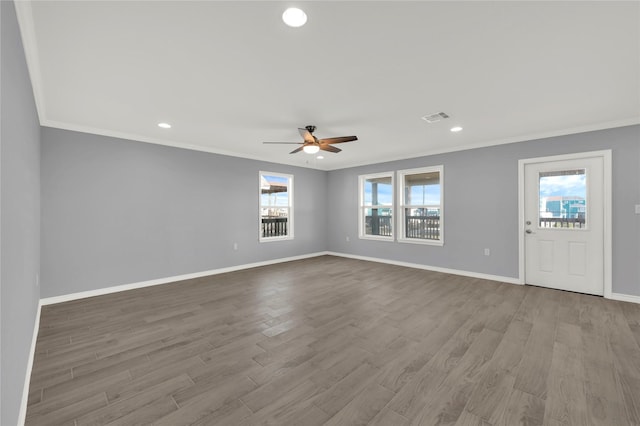 interior space with ceiling fan, light wood-type flooring, and crown molding