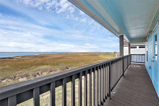 balcony featuring a water view